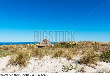 Beach Cottage On The Baltic Sea Coast In Wustrow, Germany.