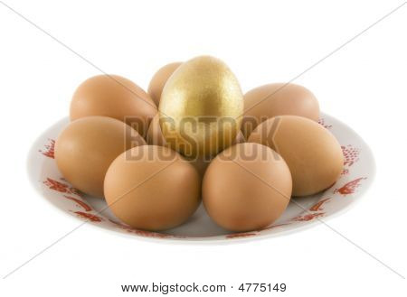 The Easter Rural Eggs Lying In White Porcelain Plate With A Red Ornament