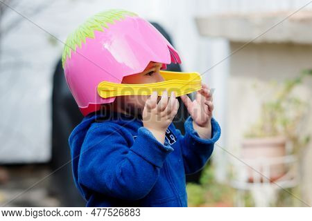 Adorable Baby With An Easter Basket For A Helmet