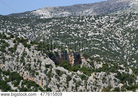 The Path To Cuile Sas Traes, View Of Monte Tiscali And Its Sinkhole