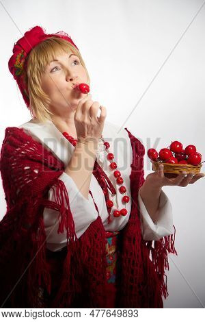 Portrait Of Heerful Funny Adult Mature Woman Solokha With Red Berries. Female Model In Clothes Of Na
