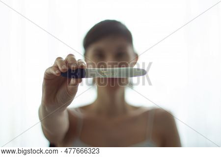 Pregnancy Test In Hands. The Test Shows A Positive Result