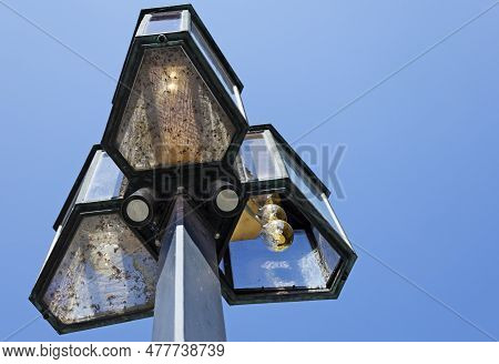 Three Street Lamps Forming A Triangle In Stockhom