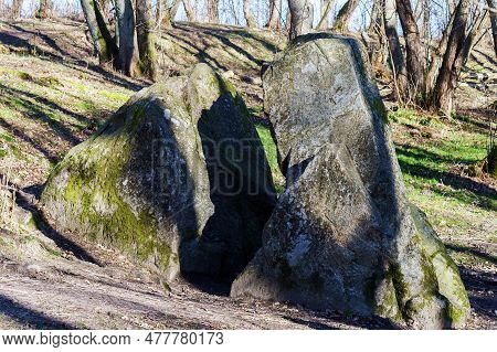 A Stone Of Lies. A Huge Rock In The Woods. A Large Boulder In The Woods. A Splintered Boulder. Kalin