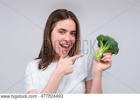 Woman Showing Broccoli. Healthy Food, Health Life. Raw Food Concept. Womans Hands Holding Bunch Of B
