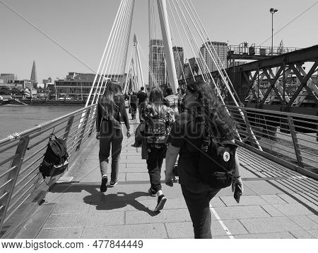 People On Golden Jubilee Bridge In London