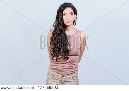 Portrait Of Attractive Latin Girl Isolated. Young Pretty Latin Girl With Serene Look On Isolated Bac