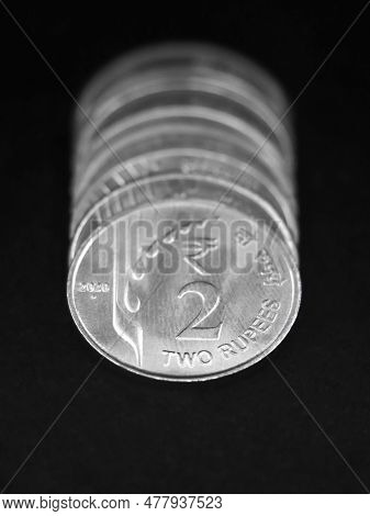 Closeup Macro Shot Of New Mint 2 Or Two Rupee Silver Coins Of India In A Row Isolated In A Black Bac