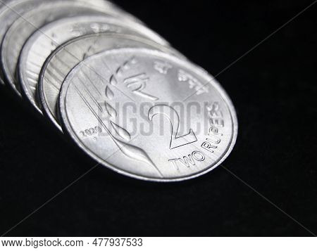 Closeup Macro Shot Of New Mint 2 Or Two Rupee Silver Coins Of India In A Row Isolated In A Black Bac