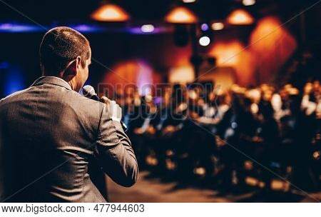 Speaker Giving A Talk On Corporate Business Conference. Unrecognizable People In Audience At Confere