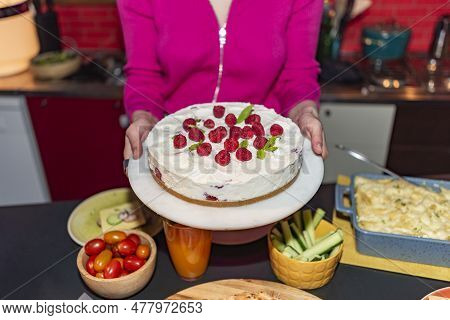 Woman Serving Strawberry Cake