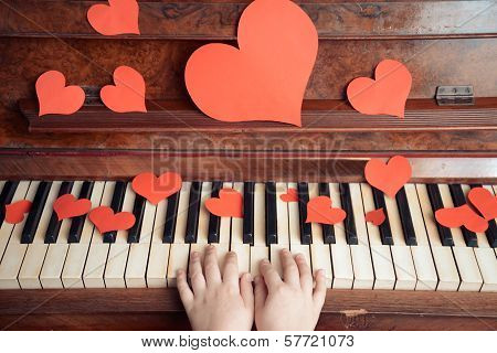 Child Plays On A Piano