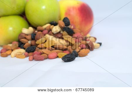 Nuts, Dried Fruits And Green And Red Apples