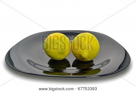 Lemons On A Black Plate