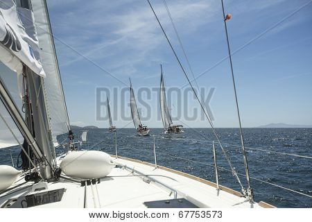 AEGEAN SEA, GREECE - APR 29, 2014: Unidentified sailors participate in sailing regatta 