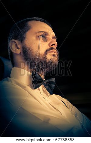 Man with Monocle and Bowtie Retro Portrait