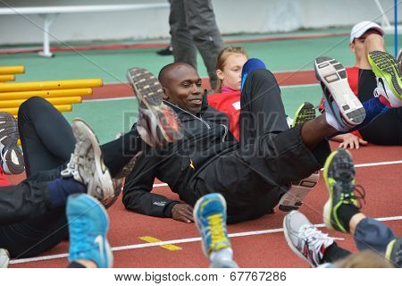 ZHUKOVSKY, MOSCOW REGION, RUSSIA - JUNE 27, 2014: IAAF World Champion Wilson Kipketer of Denmark gives a master class for young Russian athletes during the Znamensky Memorial