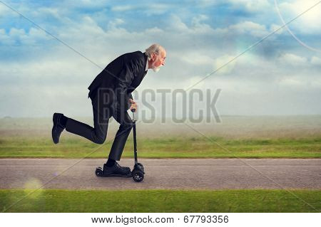 Senior Man Riding A Scooter