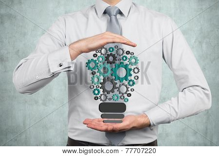 Businessman Holding Light Bulb