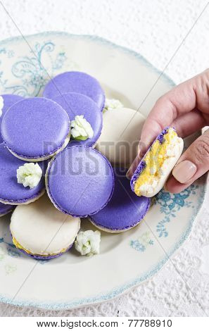 Colored makarons with tangerine ganache
