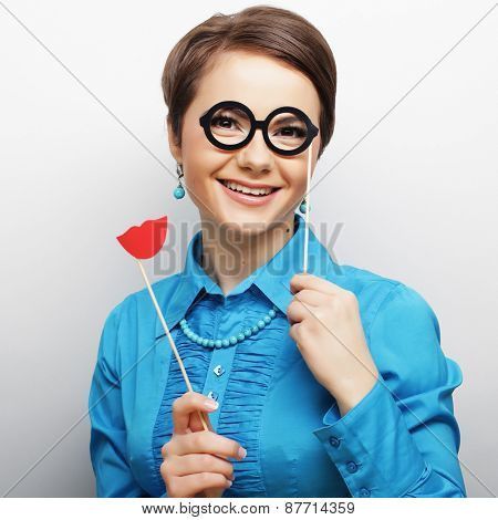 Attractive playful young woman ready for party - falce lips and glasses   