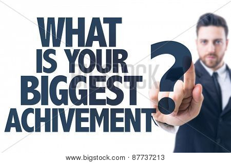 Business man pointing the text: What Is Your Biggest Achievement?