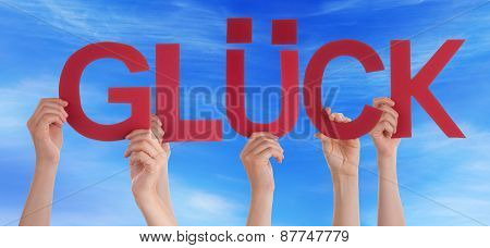 People Holding Straight German Word Glueck Means Luck Blue Sky