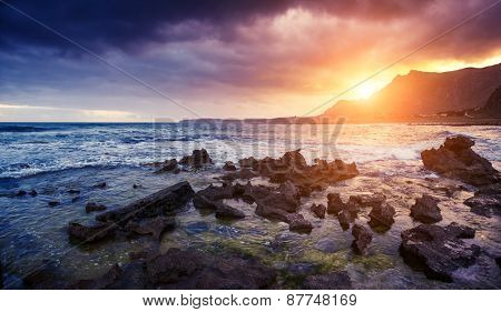 Fantastic view of the nature reserve Dello Zingaro. Dramatic morning scene. Dark overcast sky. Location cape San Vito. Sicilia, Italy, Europe. Mediterranean and Tyrrhenian sea. Beauty world.