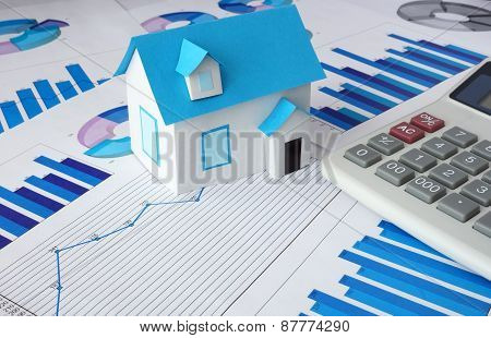 Model  house for sale and graphs. Real estate
