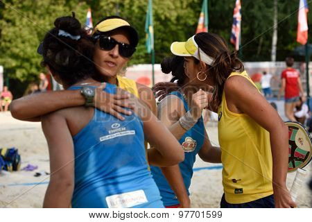 MOSCOW, RUSSIA - JULY 17, 2015: Team Brazil greeting team France after the quarterfinal match of the Beach Tennis World Team Championship. Brazil won the match 2-1