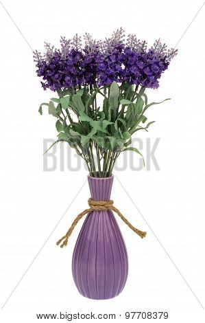 Artificial lawenda flowers in the vase isolated.