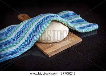 Closeup Of Pastry Dough On Baking Board