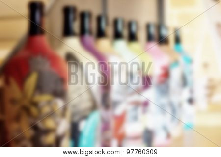 Colorful bottles of wine blurred background