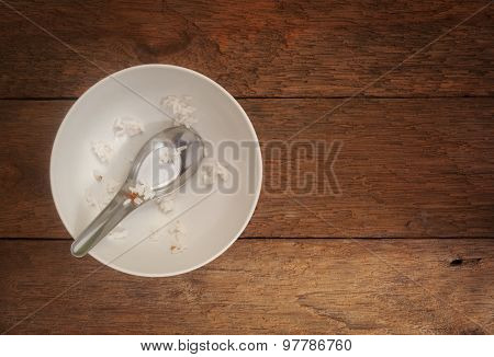White Ceramic Bowl On Wood Background