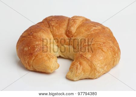 One Brown Glod Croissant Isolated