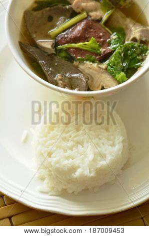 boiled pork blood and entrails soup eat couple with rice on plate