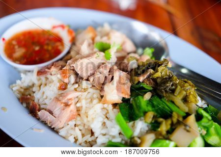 Stewed pork leg on rice dish on the tableThai food