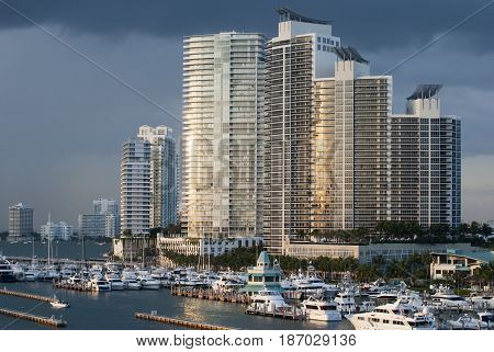 The view of Miami Beach skyscrapers and the marina in a sunset light (Florida).