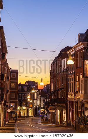 Windows shopping in Nijmegen squre city center at dusk twilight the netherlands
