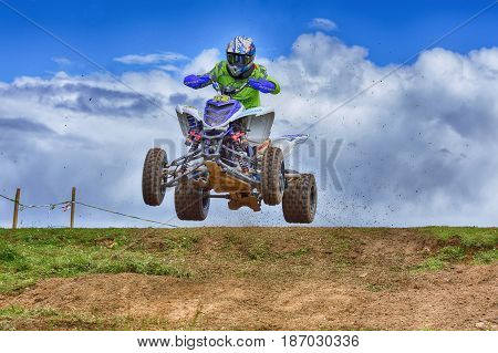 Unidentified Racer Rides A Quad Motorbike.