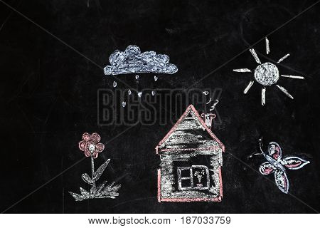 Chalk Drawing Of House And Sun On A Black Background,