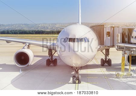 Airplane ready for boarding in a airport hub. Airplane ready for pushback in a airport hub.