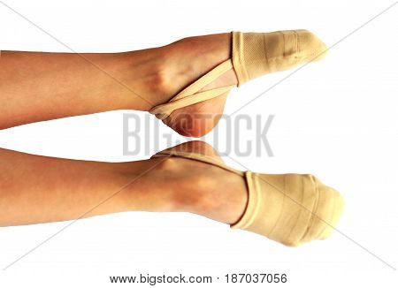 Rhythmic gymnastics shoes worn on white background.
