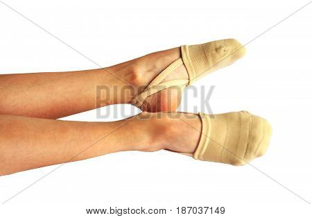 Rhythmic gymnastics shoes worn on white background.