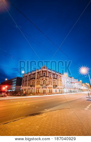 Gomel, Belarus - March 23, 2017: Old Building At Intersection Of Sovetskaya And Kommunarov Streets In Night Illuminations Lights.