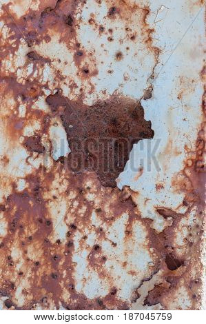 Aged weathered and peeling paint surface background.