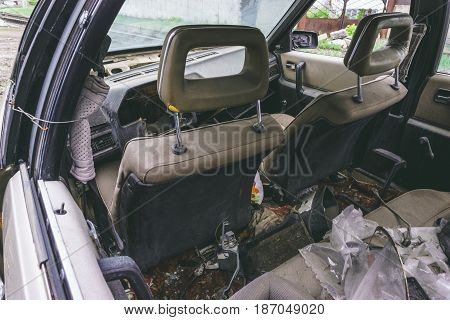 Salon of an old broken abandoned car, car left after an accident
