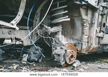 Close-up of broken abandoned rusty car, Rack, spring, brake shoes