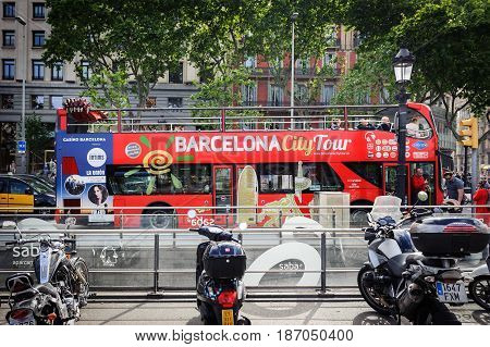 BARCELONA, SPAIN - MAY 2017: City tour excursion bus is staying parked at square 
 of Catalonia in Barcelona, Spain