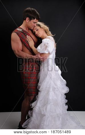 the beautiful princess is about to kiss her highlander.